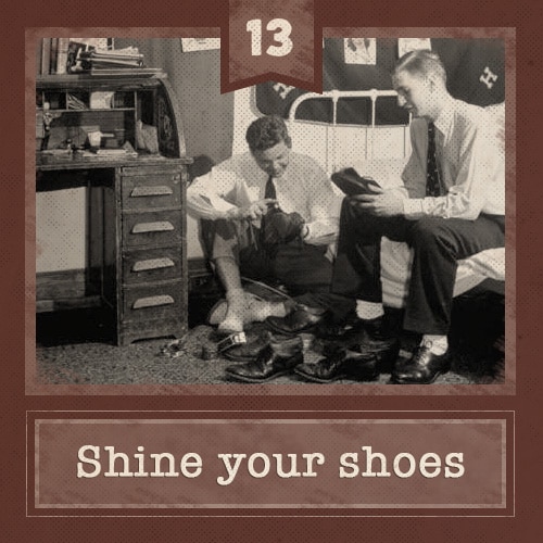 Vintage college men in dorm room shining shoes. 