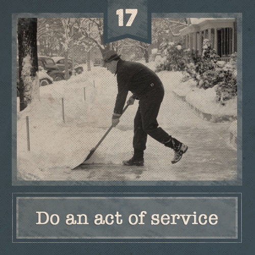 Vintage man shoveling sidewalk on snowy day. 