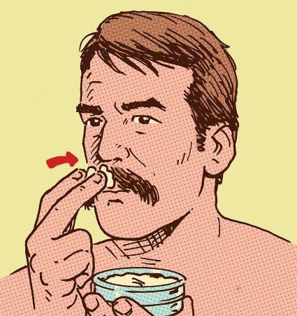 Man applying mustache wax to facial hair illustration.