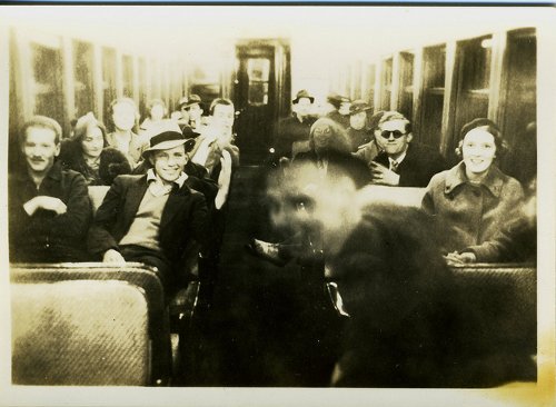 A group of people sitting on a train, displaying their personal influence.