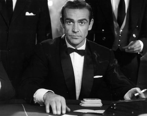 James bond sean connery wearing tuxedo gambling.