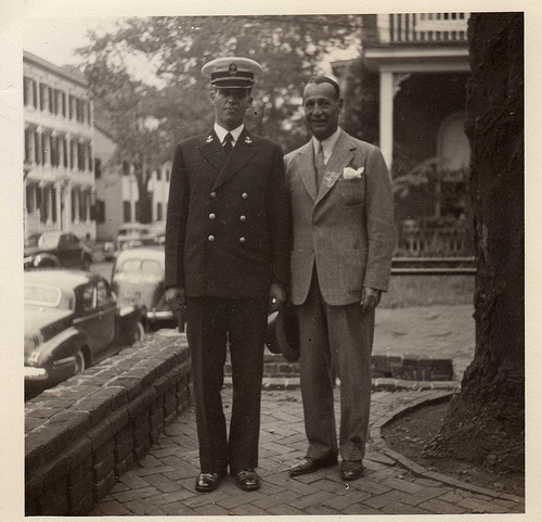 Two fathers in uniform standing next to each other, teaching valuable lessons.