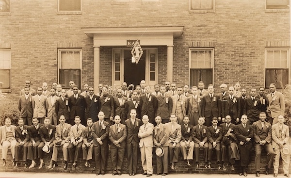 a group of men posing for a photo