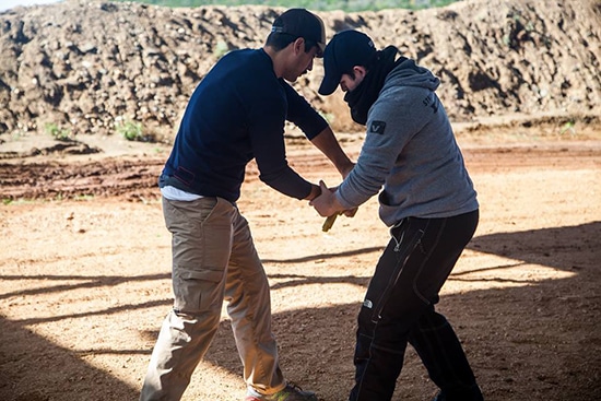 Self defense disarming an attacker with Gun drawn.