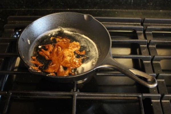 Preparing mixture for smoke bomb in a pan.