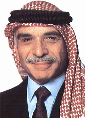 Hussein bin Talal smiling with mustache.