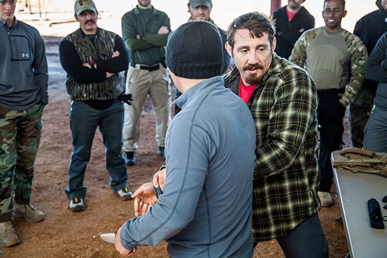 Men Gathered and Tim demonstrating defense from a Knife attack.