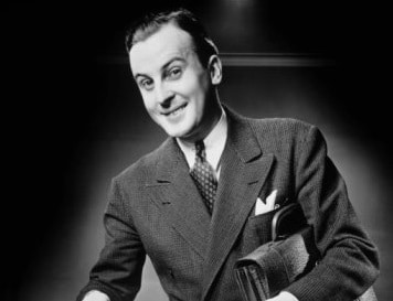 A black and white photo of a man holding a briefcase for a finance job offer.