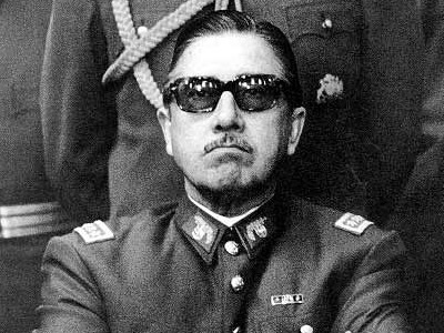 Augusto Pinochet wearing black glasses and uniform.