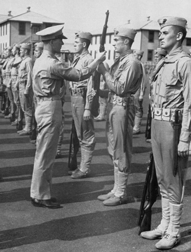 A group of men in uniform standing next to each other during WWII.