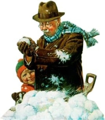 A perfect picture of a man with a shovel making a snowball in the snow.