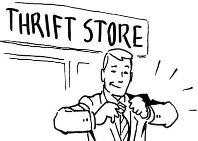 A man in a suit is adjusting his tie in front of an inexpensive thrift store.